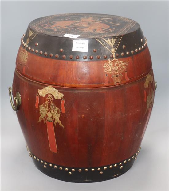 A Chinese red and black lacquer barrel shaped container